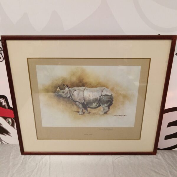 Signed David Shepherd print of an Indian rhino in a natural setting.