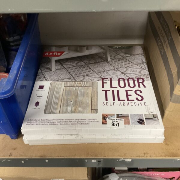 Unopened packs of dc fix wood grain floor tiles for home improvement.