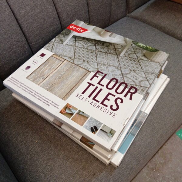 Six sealed packs of d-c-fix self adhesive floor tiles for home improvement.