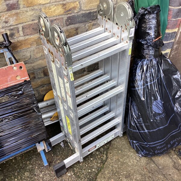 Silver aluminium decorators platform ladder, side view.