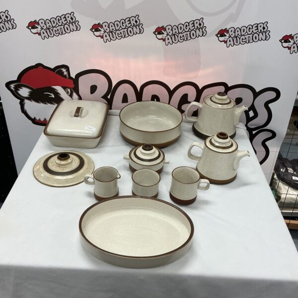 Denby stoneware collection featuring a teapot and serving pieces.