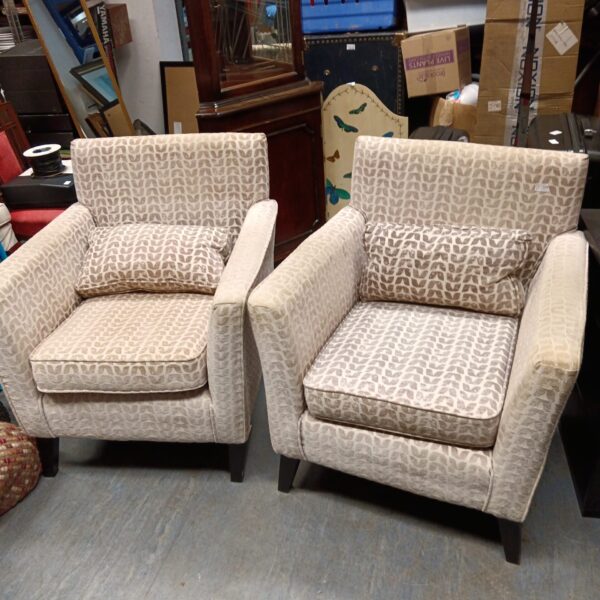 Pair of patterned designer armchairs in a vintage style.