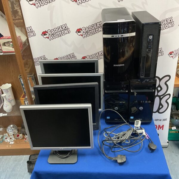 Lot of desktop computers and monitors including HP and Dell.