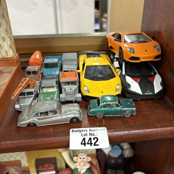Selection of vintage and modern diecast model cars.