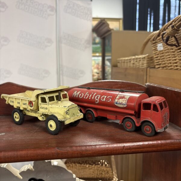 Vintage red Dinky Supertoys diecast truck with Mobilgas trailer.