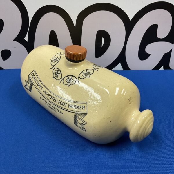 Antique Doulton Lambeth foot warmer with a simple, elegant design.