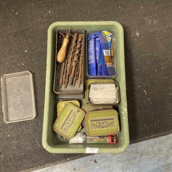 Vintage drill bit set with rivets for metalworking projects.