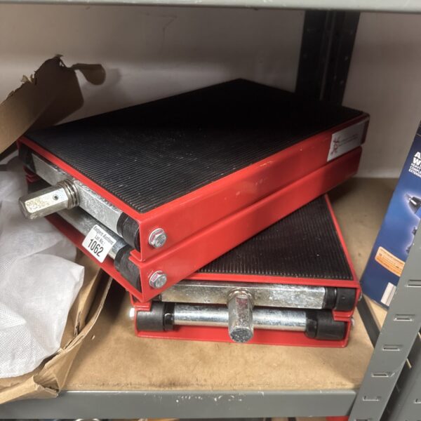 Pair of Durhand motorcycle lifts for garage maintenance.