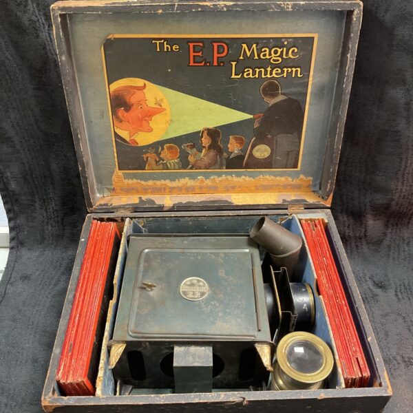 Antique E P Magic Lantern in original wooden box with slides.