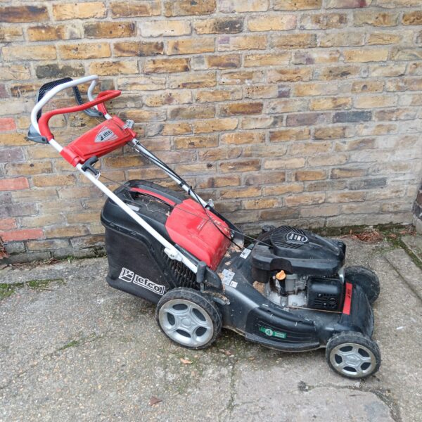 Red and black Efco EMak K650 petrol lawnmower in used condition.