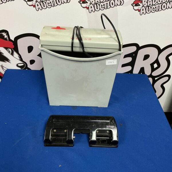 Electric paper shredder with hole punch for office use.