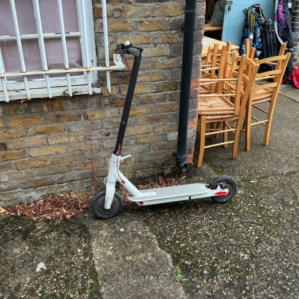 Foldable electric scooter for urban commuting and personal transport.