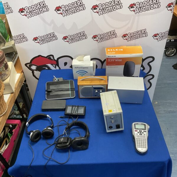 Mixed lot of vintage and modern electronics including a radio and router.