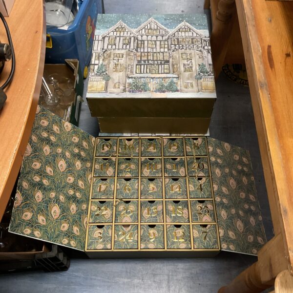 Lot of four empty Christmas calendars with festive designs.