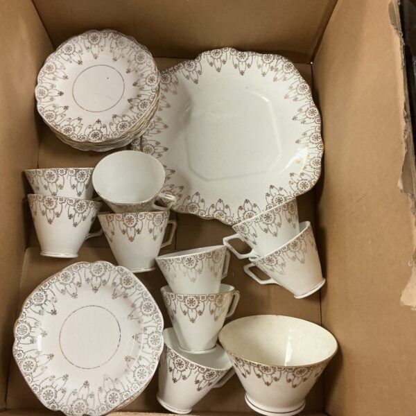 Vintage Endant China tea set with multiple cups and saucers.