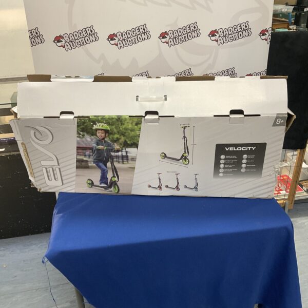 Front view of Evo Velocity folding scooter in original box.