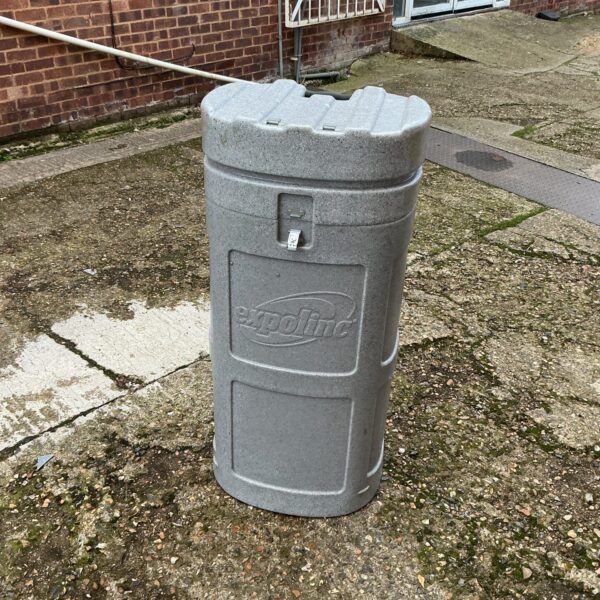 Tall Expolinc travel trunk with wheels, showing signs of wear.