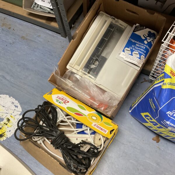Assorted extension leads and a vintage Brother typewriter in a mixed lot.