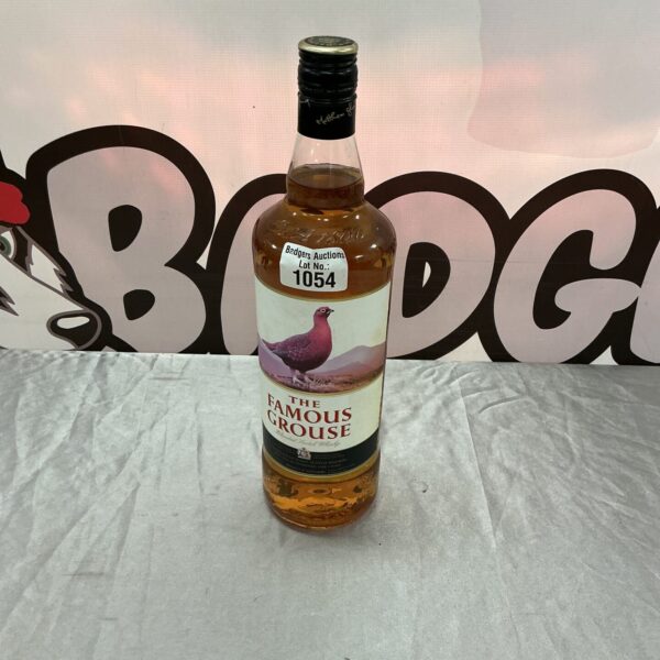 A 1ltr bottle of Famous Grouse Scotch Whisky for sale.