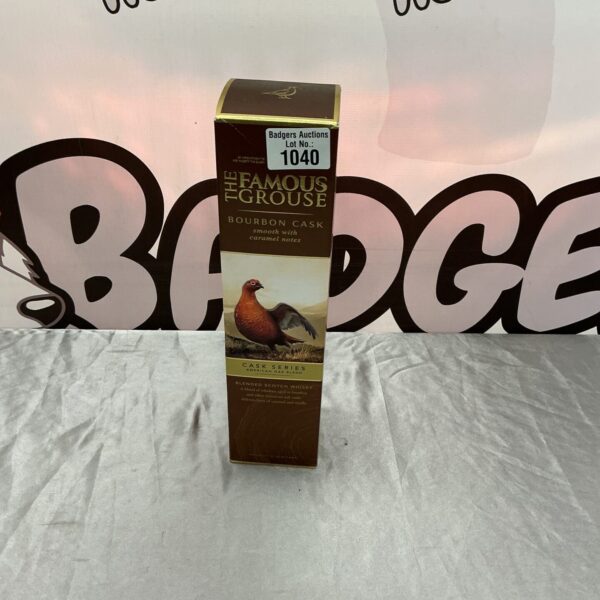 Famous Grouse whisky bottle, a collectible spirit with iconic branding.