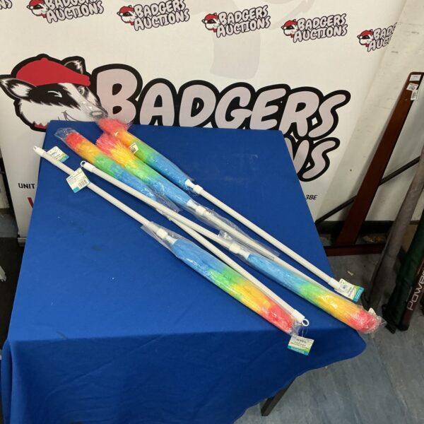 Lot of five colourful artificial feather dusters for cleaning.
