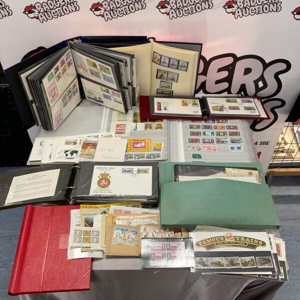 Large collection of first day stamp covers in albums, showcasing British stamps.