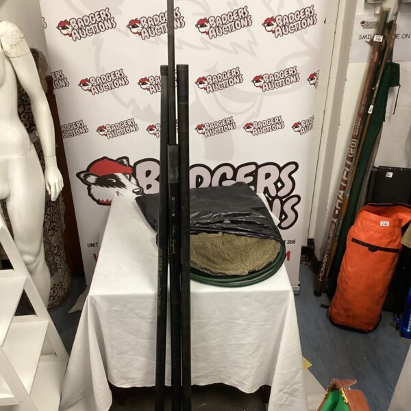 Lot of vintage fishing rods and nets for sale.