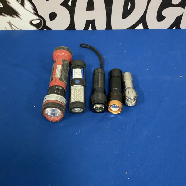 Group of handheld flashlights, including a large tactical torch.