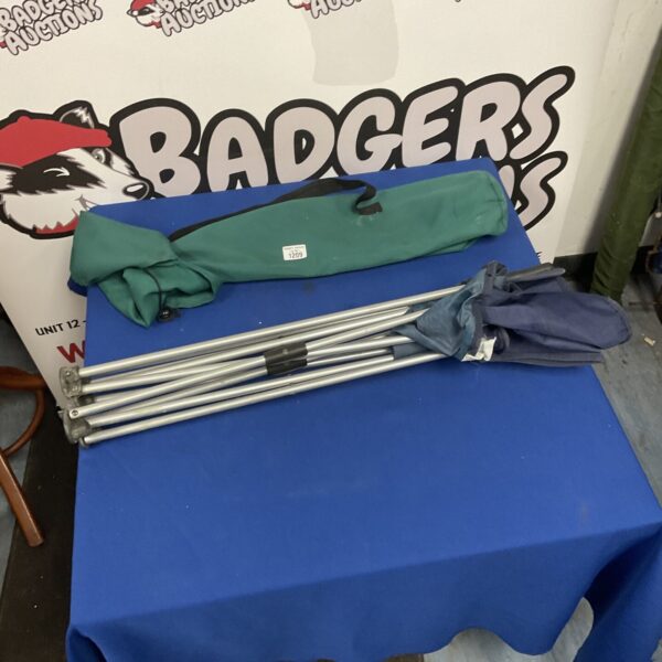 Side view of a used folding camping chair.