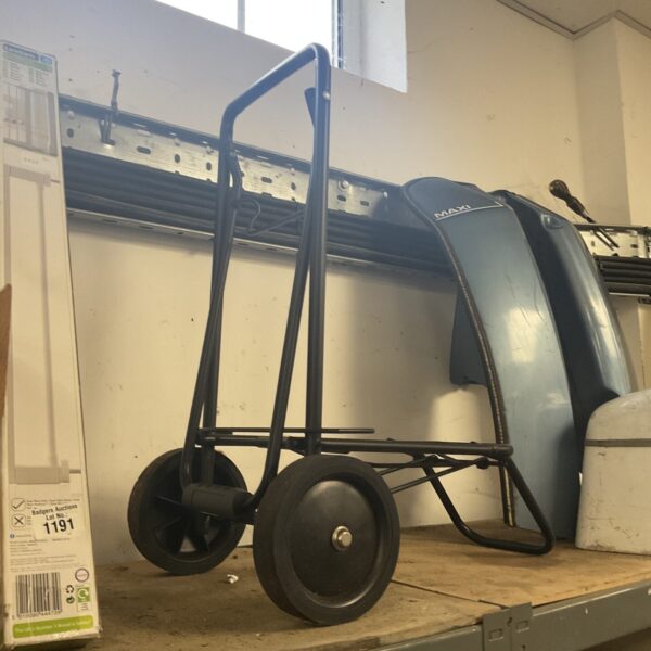 Metal folding luggage trolley for easy travel and storage.