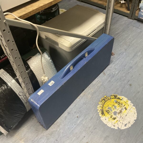 Blue plastic folding table, portable and lightweight for outdoor use.