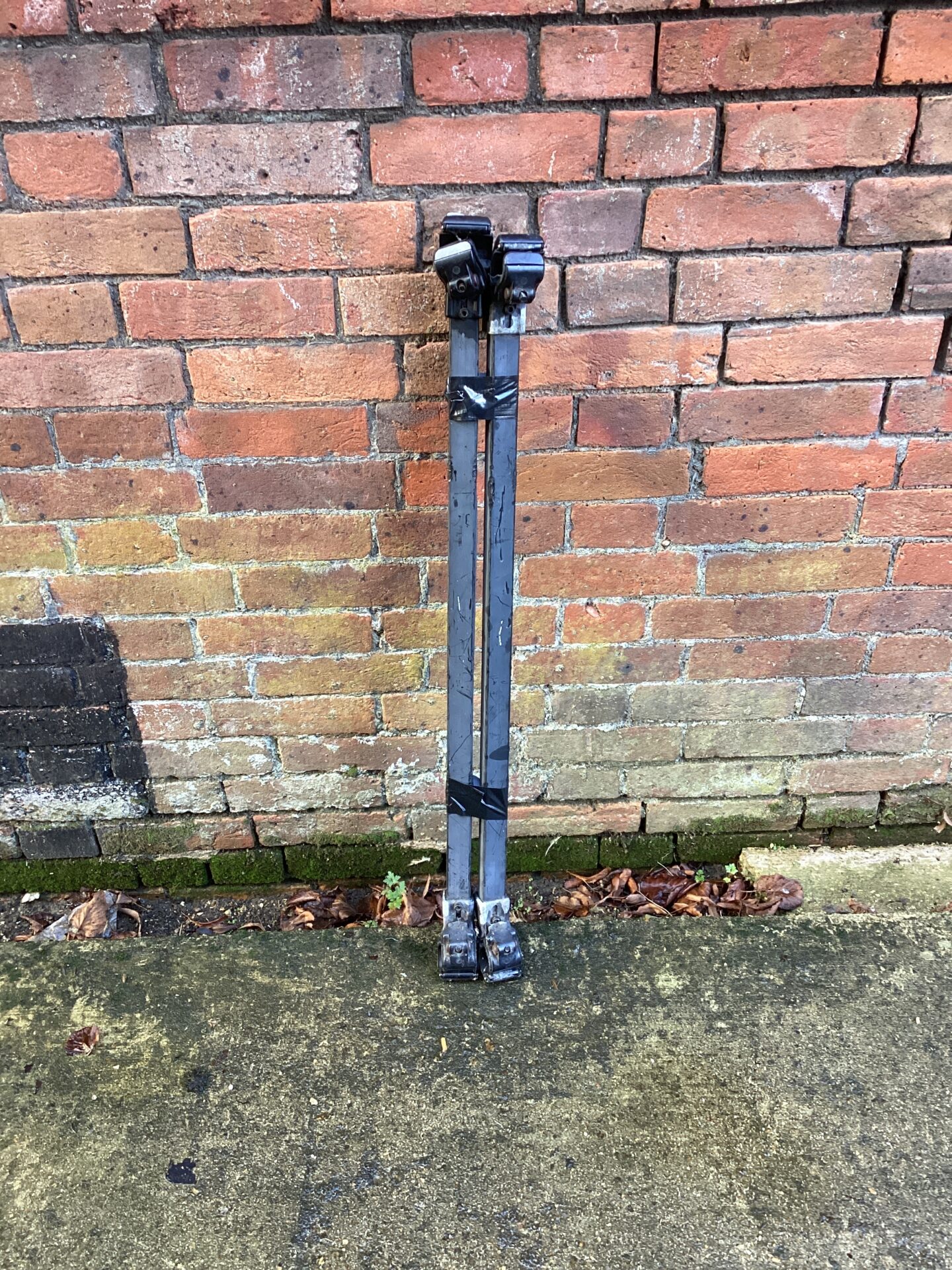 Vintage Ford Escort roof racks with key for secure load carrying.