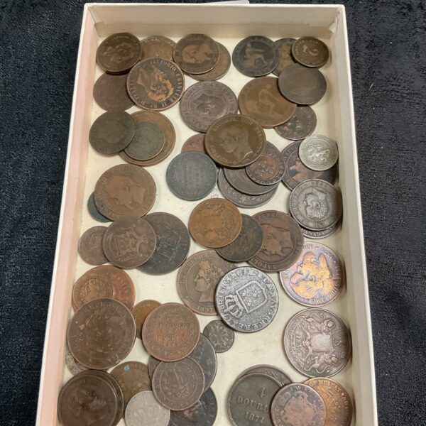 Tray of antique foreign coins from the 18th and 19th centuries.