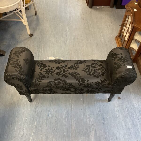 Elegant black floral upholstered French style bench.