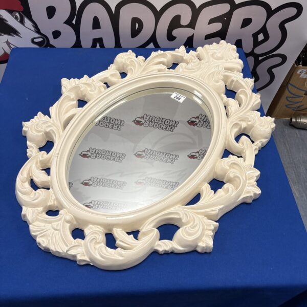 Ornate French style hall mirror with detailed sculpted frame.