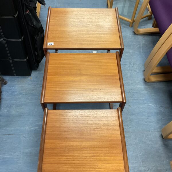 Vintage G Plan Quadrille teak nest of tables in a living room setting.