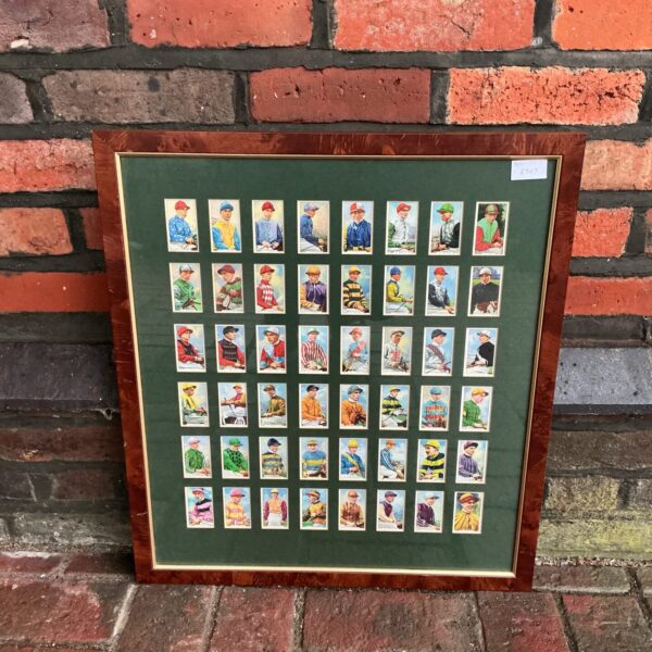 Framed vintage Gallaher jockey cigarette cards, colourful sporting ephemera.