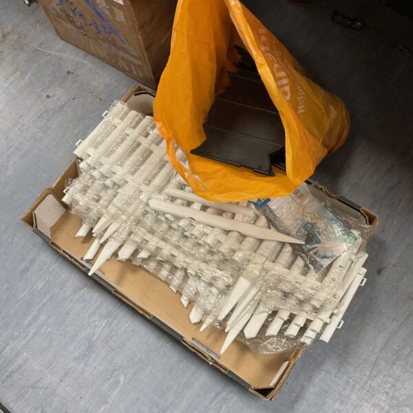 Plastic garden edging in a bag, ready for landscaping.