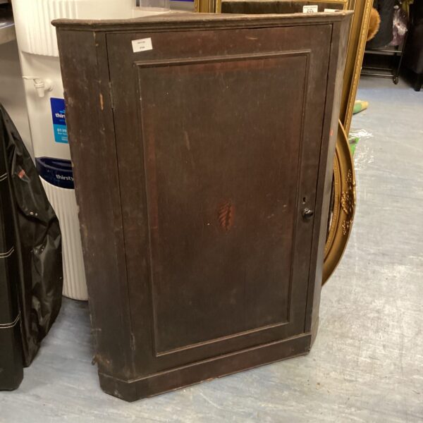 Antique Georgian corner cupboard made of mahogany wood.
