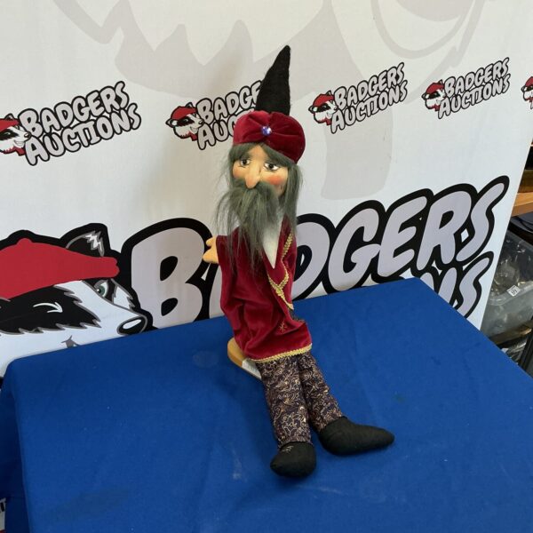 Detailed vintage German wizard glove puppet with long beard.