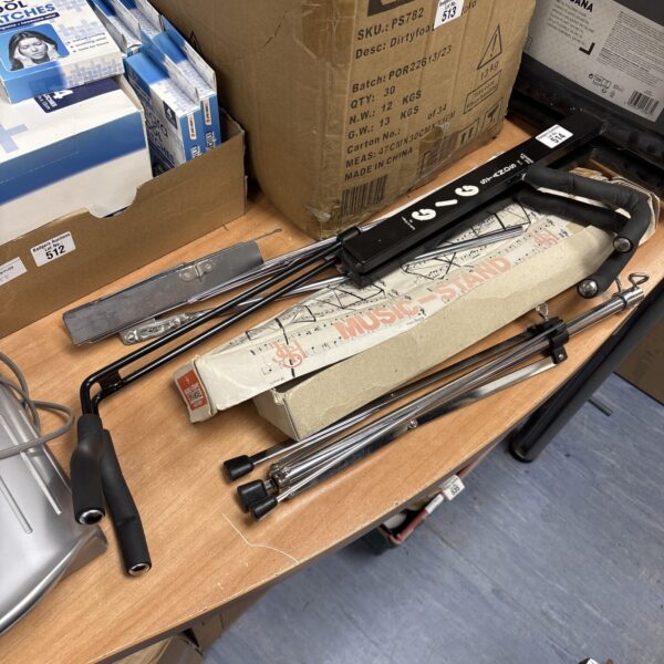 Black folding gig music stand for sheet music.