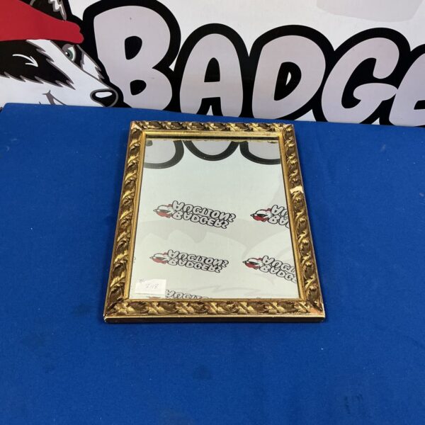 Vintage gilt framed mirror with a gold finish.