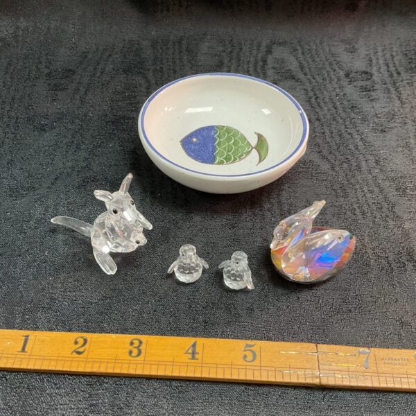 Miniature glass animal collection with fish decorated dish.