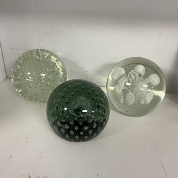 Lot of three colourful glass paperweights for collectors.