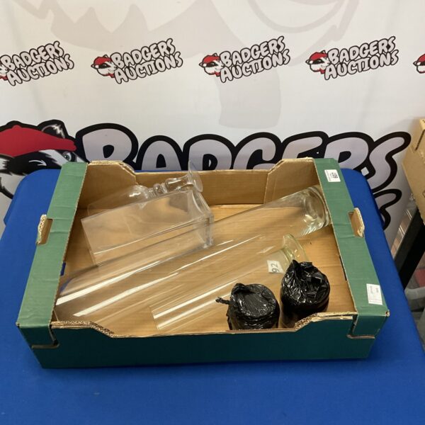 Vintage glass vase collection with colourful marbles on display.