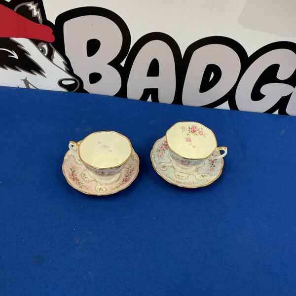 Vintage Golden Crown China tea cup and saucer with floral design.