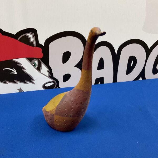 Detailed resin goose ornament for farmyard decor.