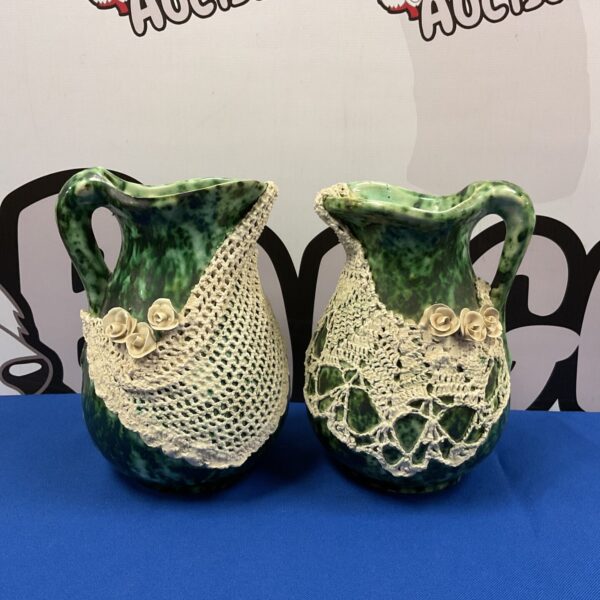 Pair of vintage green glazed fishing jugs with net design.