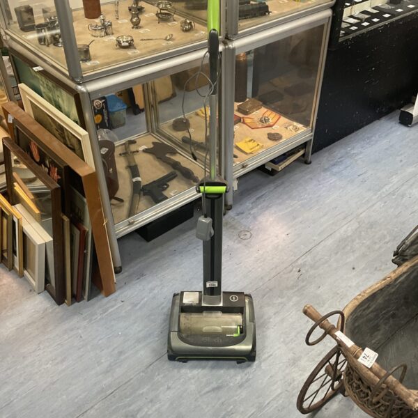 Used Gtech Air Ram cordless vacuum cleaner for home cleaning.