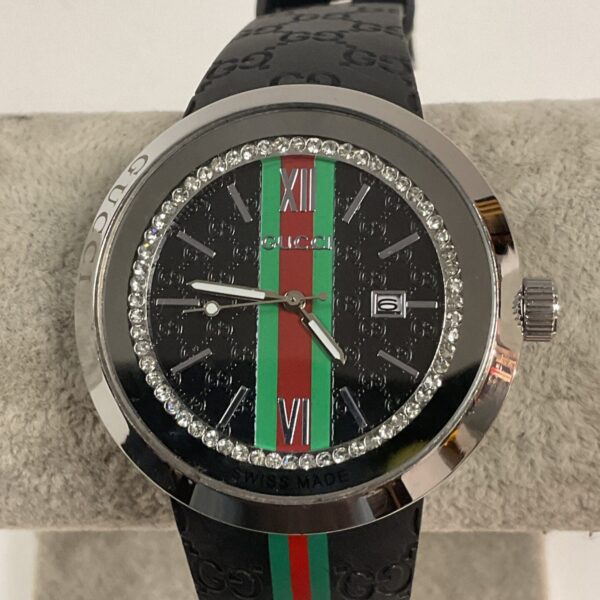 Stylish Gucci quartz wristwatch with crystal bezel and black leather strap.